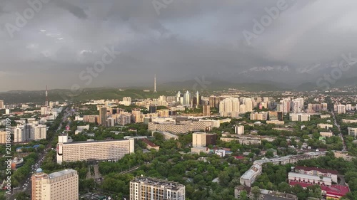 A drone view of the central part of Almaty, Kazakhstan, during sunset on a spring evening.
