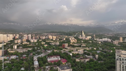 A drone view of the central part of Almaty, Kazakhstan, during sunset on a spring evening.