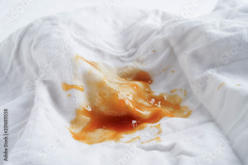 Dirty tomato sauce stain or ketchup on cloth to wash with washing powder, cleaning housework.