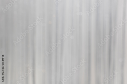 The white curtains rippled in soft, blurry waves.