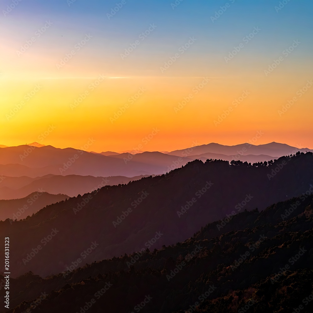 Fototapeta premium Sunset over mountain range landscape view.