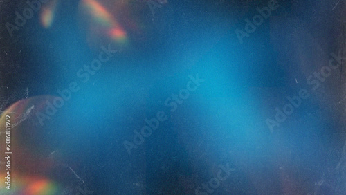 Abstract dark blue texture with light leaks and film grain