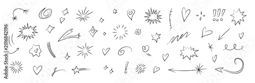 Photos Hand drawn doodle set with sparkling stars, hearts, bursts, and decorative swirls