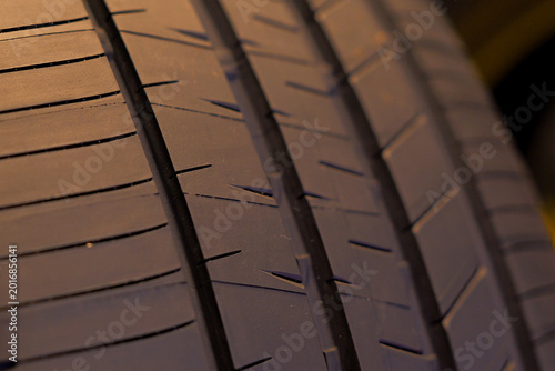 Canvastavla A close-up photograph of a new car tire, showcasing the intricate tread pattern and grooves designed for optimal performance