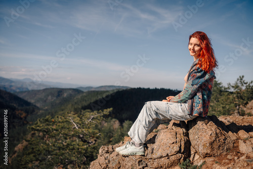 Canvastavla Red haired woman enjoying mountain landscape view