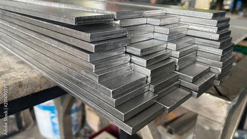 Stack of stainless steel flat bar of background. 