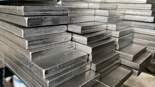 Stack of stainless steel flat bar of background. 