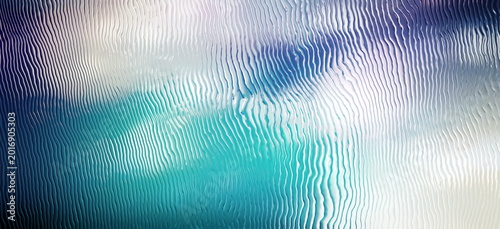 Photos Abstract frosted glass background with wavy ribbed texture, aqua blue light and