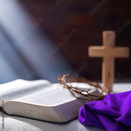 Book and Cross on a Table With a Purple Cloth in a Dimly Lit Room
