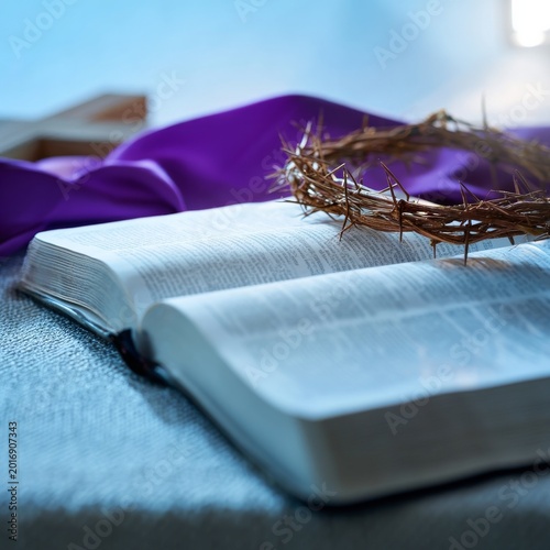 Bible Resting on a Table With a Crown of Thorns and a Cross in the Background...