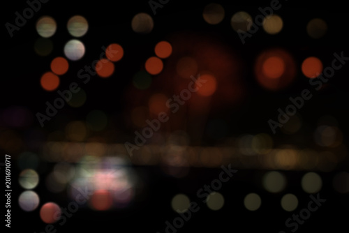 Red and white small bokeh circle design, abstract black background, modern colorful lights