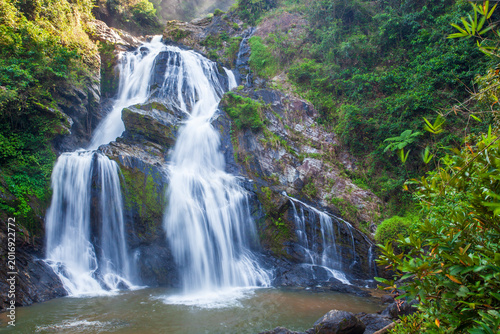 Bild auf Leinwand Krung Ching Waterfall is a beautiful waterfall nestled amidst lush rainforest in Khao Luang National Park, Nakhon Si Thammarat Province, Thailand