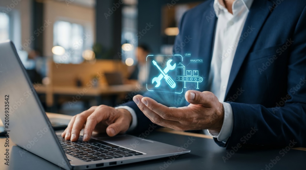 Fototapeta premium Businessman holding holographic lean analytics icon with tools and production line. Manufacturing optimization and operational efficiency concept.