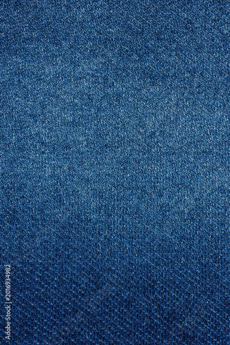 Blue denim look jersey knit fabric texture in vertical composition