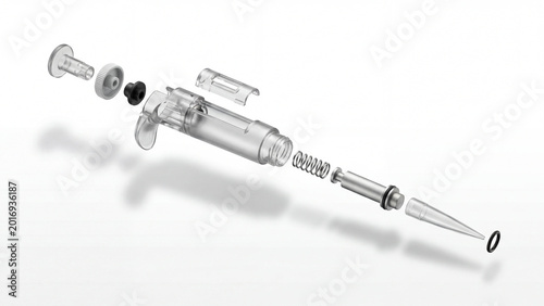 Medical syringe disassembled showing internal parts isolated on a white background