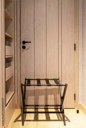 Wooden door hotel room luggage rack interior hallway floor wall handle mirror cabinet