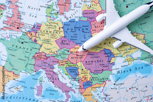 Airplane on Europe map representing international travel and global mobility