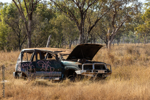 A car in the Australian bush, rusty and abandoned