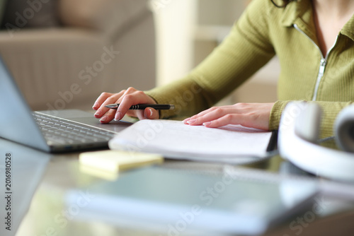 Student hands e-learning using notebook and laptop
