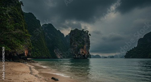 Dramatic Coastal Landscape with Tall Limestone Cliffs and Cloudy Sky in Tropical Bay