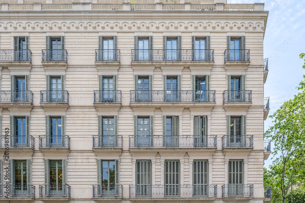 Obraz premium Apartment Building Facade with Balconies in Barcelona, Classic Traditional, Spain, Eixample District
