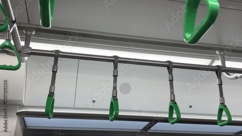 Green handrails for holding onto electric trains. 