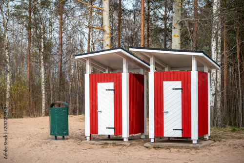 Finland. Changing room on the beach. There is a trash can nearby. Everything is beautiful, neat and clean.