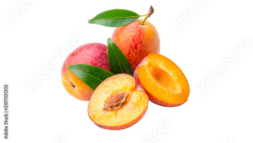Slika na platnu Several whole ripe apricots with velvety orange skin and fresh leaves for health