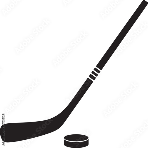 Photography A minimalist black silhouette of a hockey stick and puck, poised for action on a