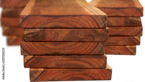 Schilderij op canvas Teakwood blocks on a stack with bokeh view