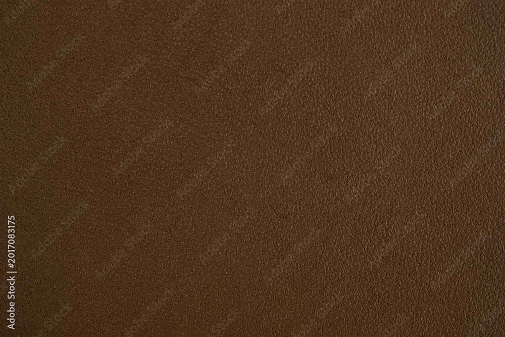 Fototapeta premium Close up of rich brown leather surface with subtle texture for background