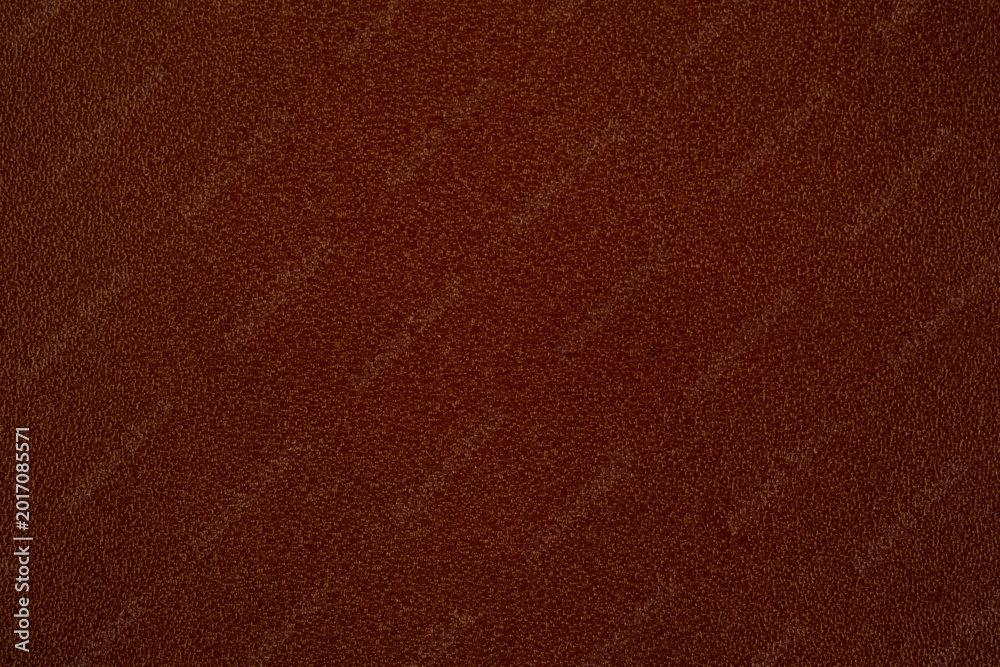 Fototapeta premium Close up of rich brown leather surface texture with subtle detailing for backgrounds