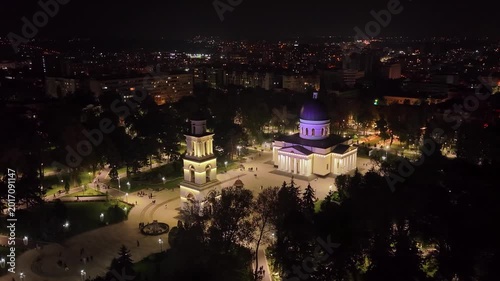 Cinematic night approach to Chisinau Cathedral and illuminated Bell Tower