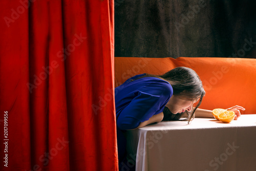 Scene of a woman in an interior behind a velvet curtain VII