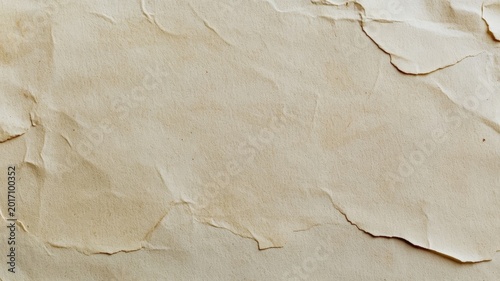 Vintage textured crumpled paper background featuring aged off white parchment surface with folded creases for artistic design.