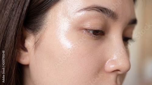 Extreme close up glass skin smooth complexion glowing healthy face natural makeup hydrated skin clear pores youthful appearance radiant beauty skincare female serene
