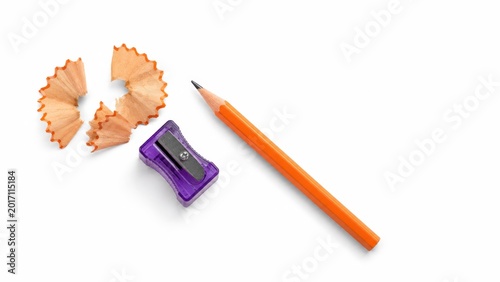 Translucent purple pencil sharpener with orange pencil and fan shaped shavings for stationery flat lay