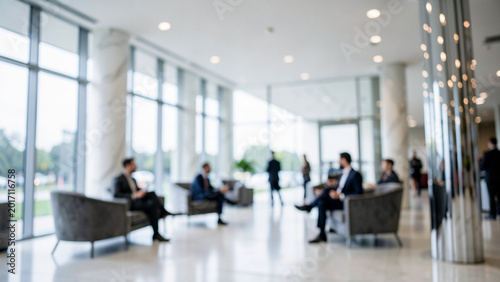 Business professionals waiting in a modern corporate lobby or office space