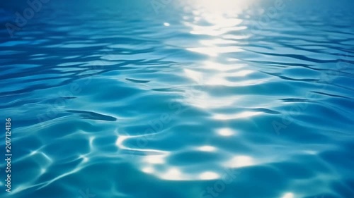 Sunlight Glinting on Rippling Blue Water Surface