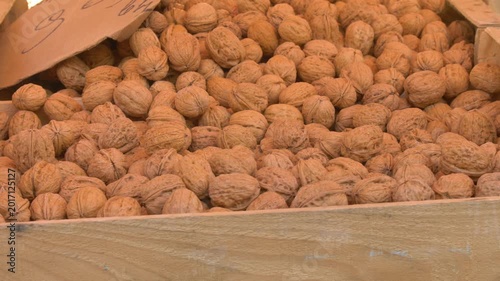 Fresh walnuts in shell at local market