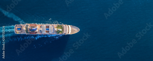 Bild auf Leinwand Aerial overhead view of a generic cruise ship sailing over the blue ocean with c