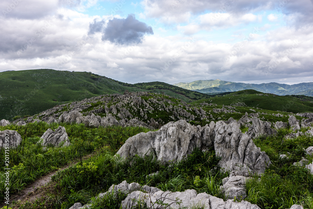 Fototapeta premium Dramatic cloudy sky over the Akiyoshidai karst plateau in Yamaguchi, Japan