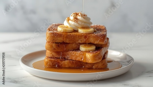 Stack of golden french toast topped with whipped cream and sliced bananas maple syrup golden brown food photography sweet breakfast fruit topping baked goods home made breakfast pancakes