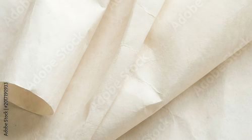 Gently crumpled white paper backdrop showcasing delicate folds and subtle textures, creating an ethereal and elegant soft focus aesthetic for various design projects