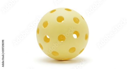 Fotografi Yellow plastic ball with holes for outdoor games and sports activities, perfect for playtime and exercise, versatile ball used for various games including pickleball and recreational fun