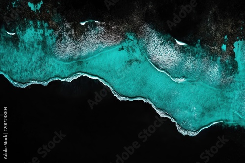 Turquoise sea against black background showing waves in minimal style and high resolution