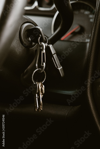 Canvas Print Car ignition key and multiple house keys hanging from a keychain