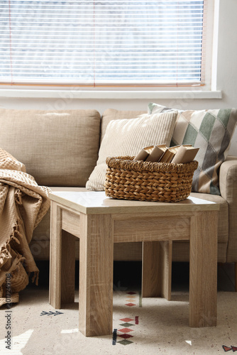 Wicker basket with books on...