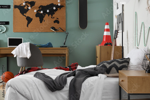 Εκτύπωση καμβά Interior of messy teenager's room with bed, workplace and lamps