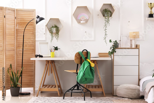 Stylish teenage room with c...